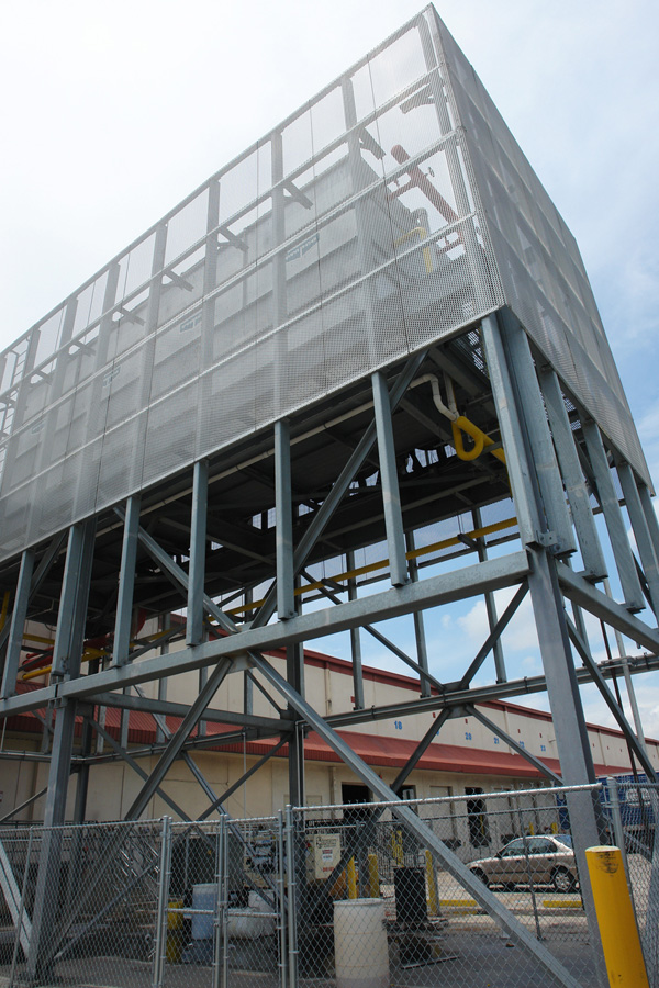 The galvanized steel evaporative condenser platform standing above the building